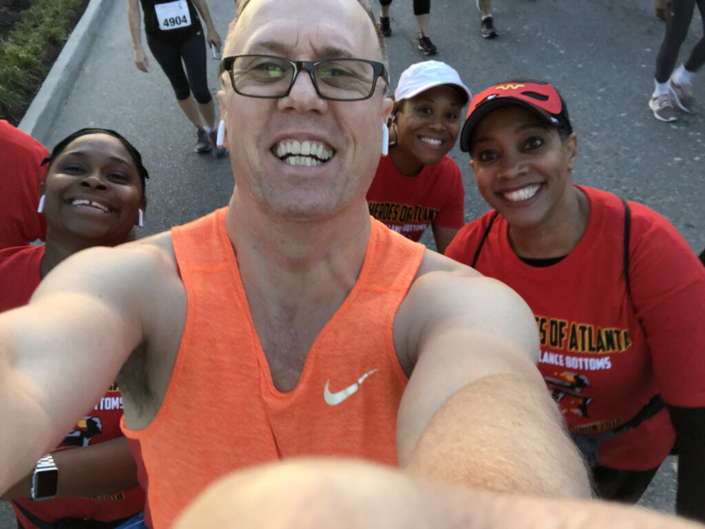 Doug running a 5k with other City of Atlanta employees, showcasing non professional development in HR