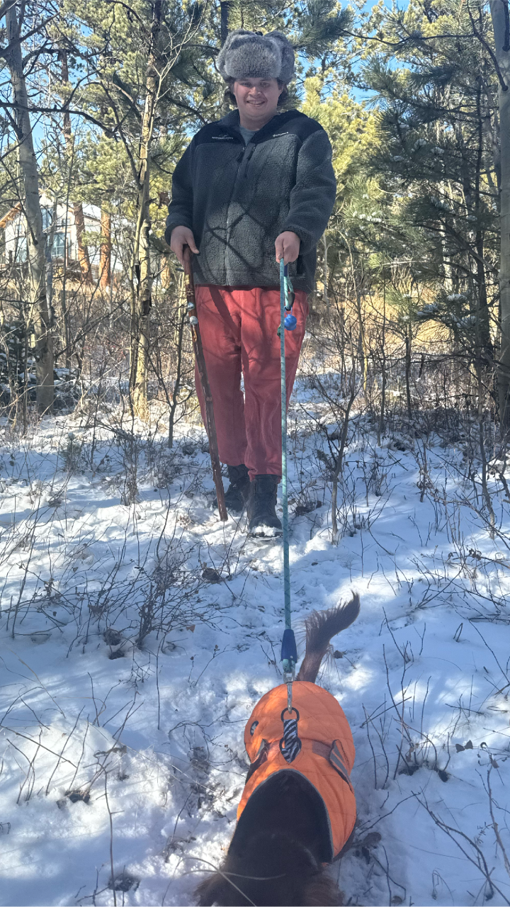 Jack with a dog walking in the snow
