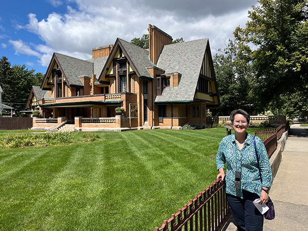 Lale in front of the Nathan G. Moore House