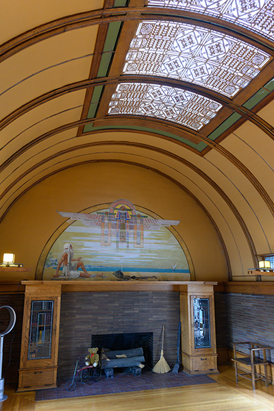 An arched ceiling and fireplace